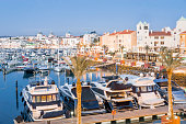 Marina with luxurious yachts and sailboats in touristic Vilamoura, Algarve, Portugal