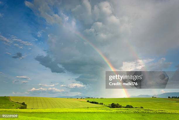 landscape and  rainbow - rainbow sky stock pictures, royalty-free photos & images