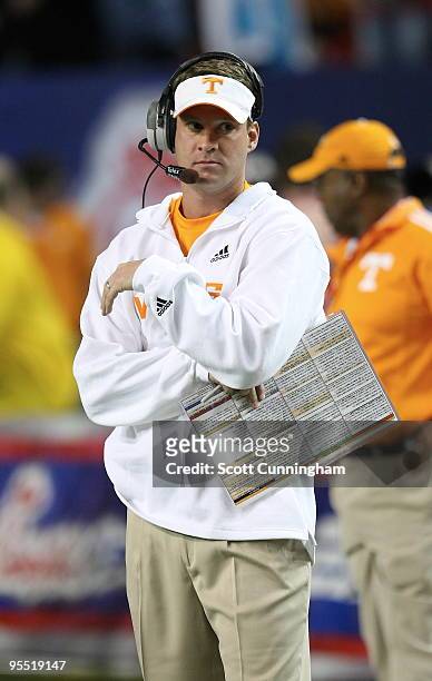 Head Coach Lane Kiffin of the Tennessee Volunteers watches the action during the Chick-Fil-A Bowl game against the Virginia Tech Hokies at the...
