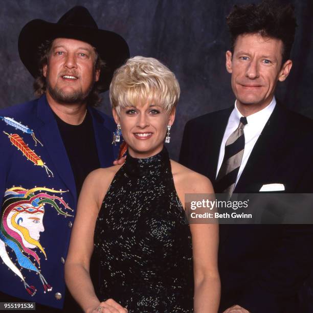 Country singer and songwriter John Anderson, Lori Morgan, and Lyle Lovett backstage the CMA Award Show Backstage October 10, 1988 in Nashville,...