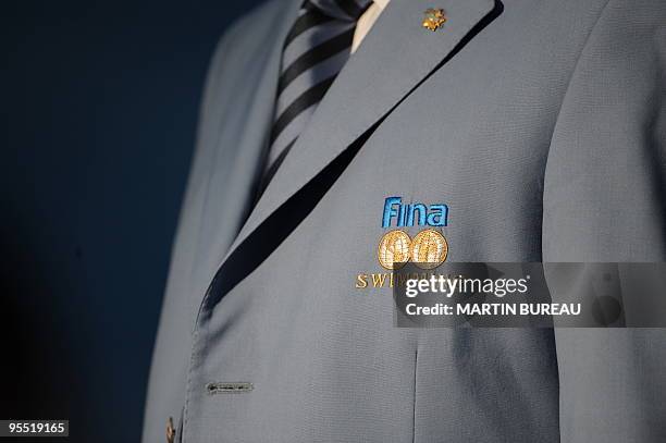 An official wears a jacket bearing the logo of the Swimming governing body FINA on July 27, 2009 at the FINA World Swimming Championships in Rome....