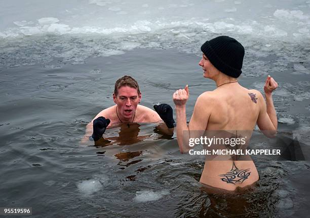 Winter swimmers of the "Berlin Seals" association take the traditional new year swim at one degree celcius water temperature in the Orankesee Lake on...