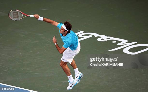 Swiss Roger Federer serves to Robin Soderling of Swededn during their semi-final tennis match of the 250,000-dollar Capitala World Tennis...