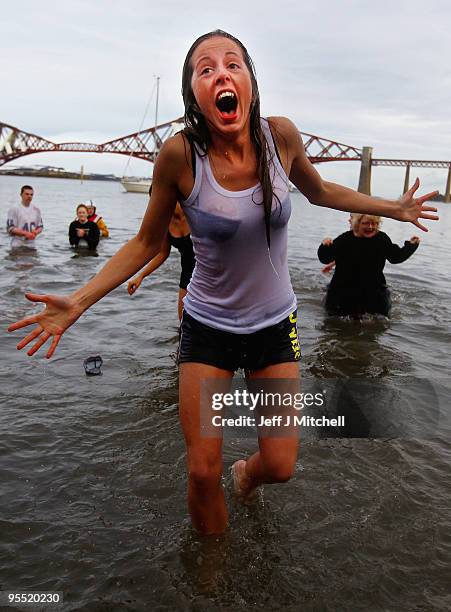 New Year revellers, many in fancy dress, braved freezing conditions at the River Forth in front of the Forth Rail Bridge during the Loony Dook Swim...