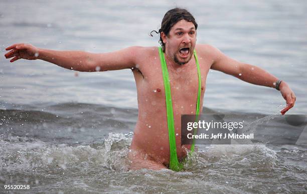 New Year revellers, many in fancy dress, braved freezing conditions at the River Forth in front of the Forth Rail Bridge during the Loony Dook Swim...