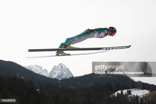 Janne Ahonnen of Finland soars over Germany's highest mountain Zugspitze and Waxenstein during the first round of the FIS Ski Jumping World Cup event...