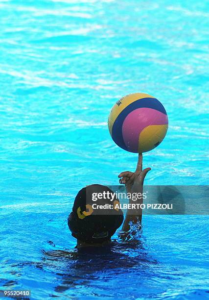 Brazil's Flavia Fernandes plays with the ball during her team's water-polo game against Germany on July 21, 2009 at the FINA World Swimming...