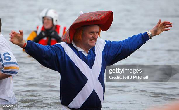 New Year revellers many in fancy dress, braved freezing conditions in the River Forth in front of the Forth Rail Bridge during the Loony Dook Swim on...