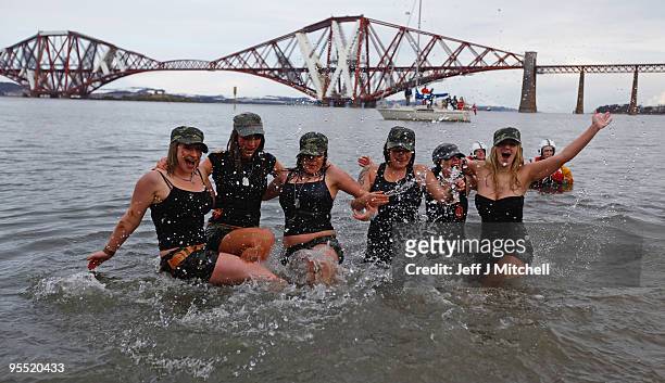 New Year revellers many in fancy dress, braved freezing conditions in the River Forth in front of the Forth Rail Bridge during the Loony Dook Swim on...