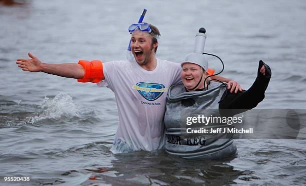 New Year revellers many in fancy dress, braved freezing conditions in the River Forth in front of the Forth Rail Bridge during the Loony Dook Swim on...