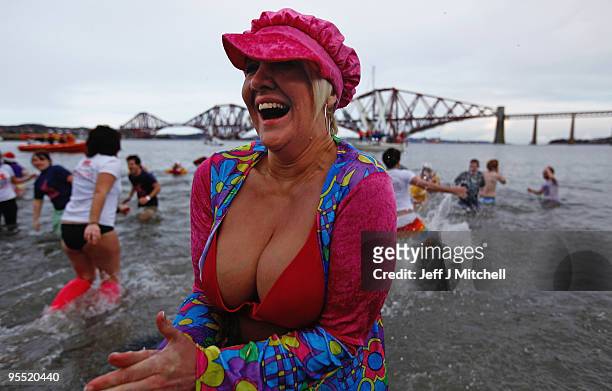 New Year revellers many in fancy dress, braved freezing conditions in the River Forth in front of the Forth Rail Bridge during the Loony Dook Swim on...