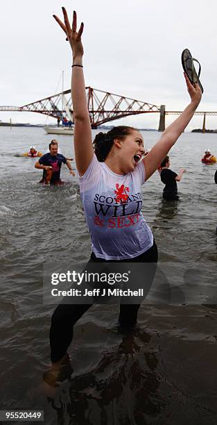 New Year revellers many in fancy dress, braved freezing conditions in the River Forth in front of the Forth Rail Bridge during the Loony Dook Swim on...