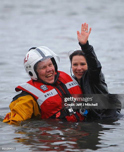 New Year revellers many in fancy dress, braved freezing conditions in the River Forth in front of the Forth Rail Bridge during the Loony Dook Swim on...