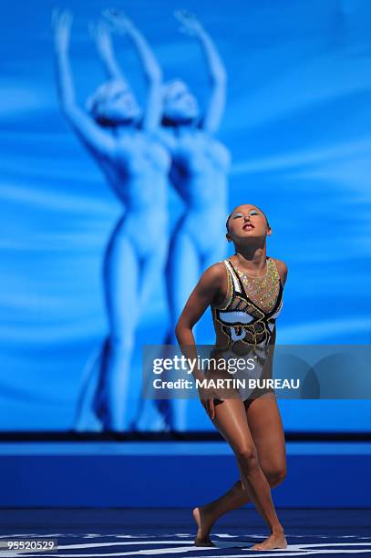 Japan's Adachi Yumi competes during the synchronised technical solo final on July 20, 2009 at the FINA World Swimming Championships in Rome. Russia's...