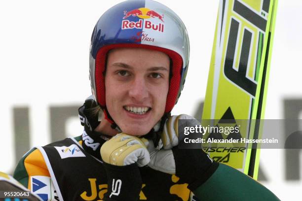 Gregor Schlierenzauer of Austria smiles after winning the FIS Ski Jumping World Cup event of the 58th Four Hills ski jumping tournament at the...