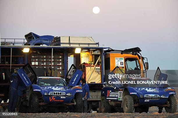 French drivers Jean louis Schlesser and Francois Lethier's cars are seen in the bivouac before the third stage between La Momie and Mrhimina of the...