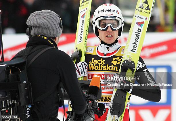 Simon Ammann celebrates after reaching the third place during the FIS Ski Jumping World Cup event of the 58th Four Hills Ski Jumping tournament at...