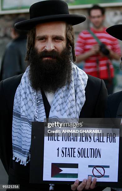 Member of Neturei Karta, a fringe ultra-Orthodox movement within the anti-Zionist bloc in Israel, join a protest against the eviction of Palestinians...