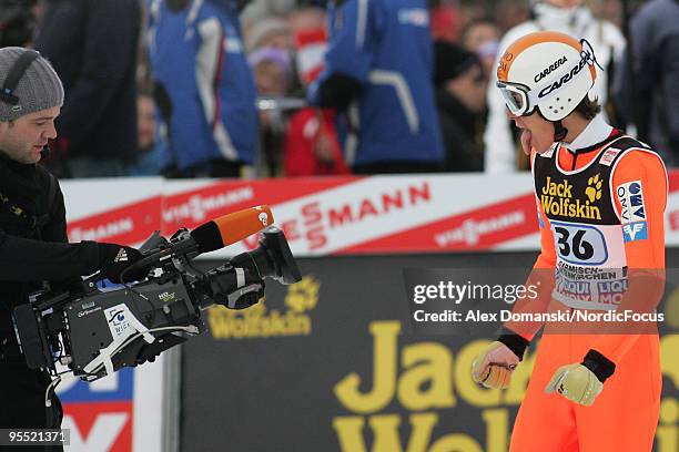 Stefan Thurnbichler of Austria reacts after the final jump during the FIS Ski Jumping World Cup event of the 58th Four Hills Ski Jumping tournament...