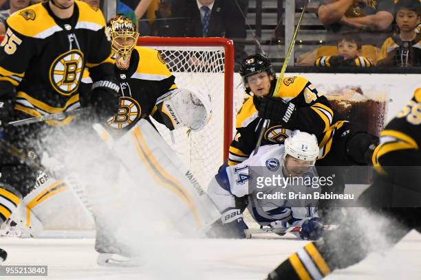 Chris Kunitz of the Tampa Bay Lightning fights for position with Torey Krug of the Boston Bruins in Game Four of the Eastern Conference Second Round...