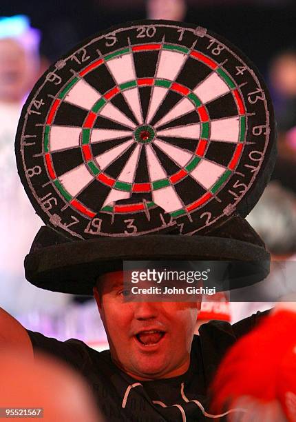 Fan cheers during the Quarter Finals match between Simon Whitlock of Australia and James Wade of England in the 2010 Ladbrokes.com World Darts...