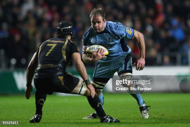 Xavier Rush of the Blues in action against Marty Holah of the Ospreys during the Magners League match between Ospreys and Cardiff Blues at the...