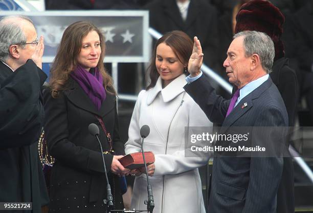 New York Mayor Michael Bloomberg takes the oath of office administered by New York State Chief Judge Jonathan Lippman as his daughters Emma Bloomberg...