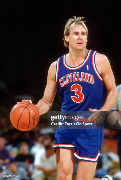 Craig Ehlo of the Cleveland Cavaliers dribbles the ball against the Milwaukee Bucks during an NBA basketball game circa 1990 at the Bradley Center in...