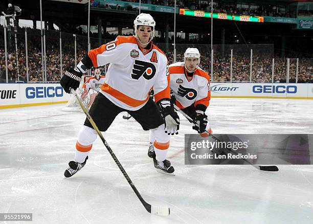 Chris Pronger and Blair Betts of the Philadelphia Flyers set up in the defensive zone against the Boston Bruins on January 1, 2010 during the 2010...