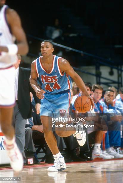 Derrick Coleman of the New Jersey Nets dribbles the ball up court against the Washington Bullets during an NBA basketball game circa 1991 at The...