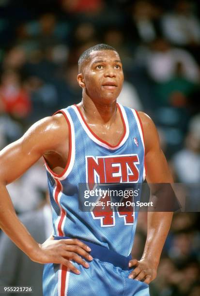 Derrick Coleman of the New Jersey Nets looks on against the Washington Bullets during an NBA basketball game circa 1991 at The Capital Centre in...