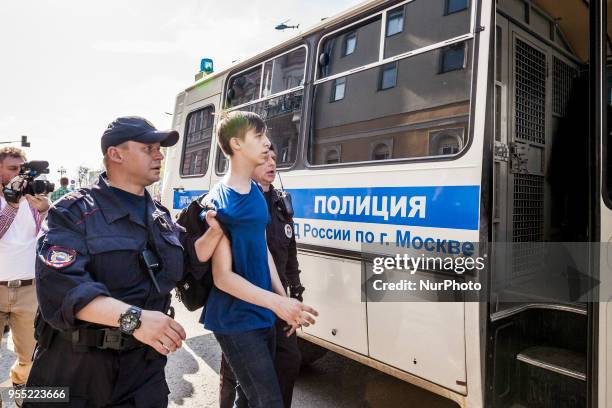 Teenager is arrested by riot police in a demonstration against Putin in Pushkin square, Moscow, Russia, on 5 May 2018.