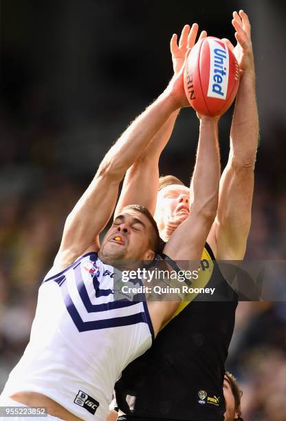 Stephen Hill of the Dockers and Jack Riewoldt of the Tigers compete for a mark during the round seven AFL match between the Richmond Tigers and the...