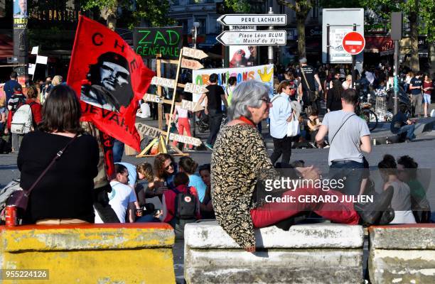 Protesters gather at the place de la Bastille for a rally dubbed as "The Party for Macron" to protest against the policies of the French president on...