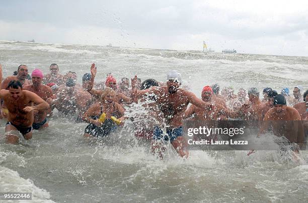 Swimmers take part in the 'New Year's Dip' in the cold water of the Tyrrhenian Sea, on January 1, 2010 in Livorno, Italy. This is the 27th edition of...