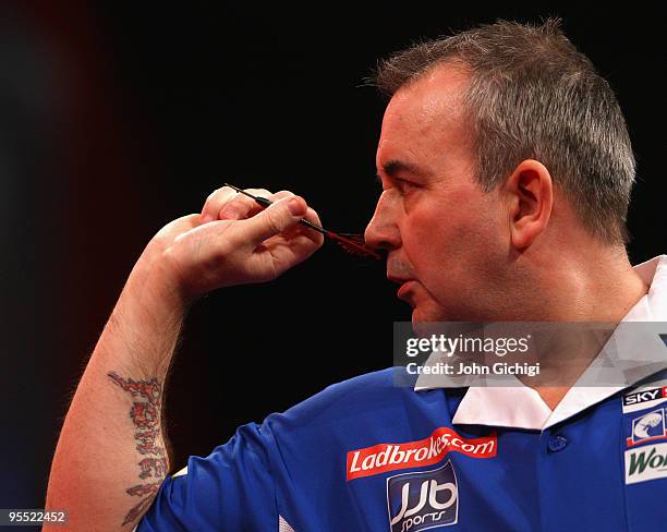 Phil Taylor of England in action in his game against Adrian Lewis of England during the Quarter Finals of the 2010 Ladbrokes.com World Darts...