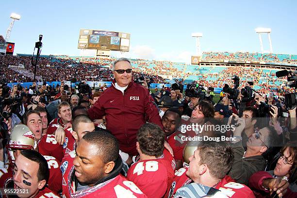 Head coach Bobby Bowden of the Florida State Seminoles is carried off the field by his players after defeating the West Virginia Mountaineers during...