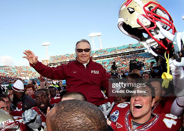 Head coach Bobby Bowden of the Florida State Seminoles is carried off the field by his players after defeating the West Virginia Mountaineers during...