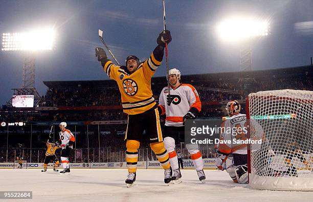 Marco Sturm of the Boston Bruins celebrates after he scored the game-winning goal in overtime to win 2-1 against goalie Michael Leighton and Braydon...