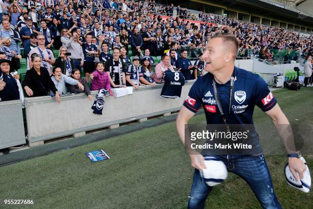 Besart Berisha throws out signed footballs during a fan gathering AAMI Park on May 6, 2018 in Melbourne, Australia. Melbourne Victory defeated the...