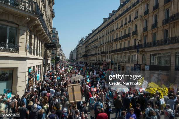People take part in a protest dubbed a 'Party for Macron' against the policies of the French president on the first anniversary of his election, on...