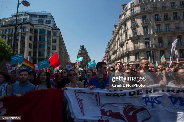 People take part in a protest dubbed a 'Party for Macron' against the policies of the French president on the first anniversary of his election, on...