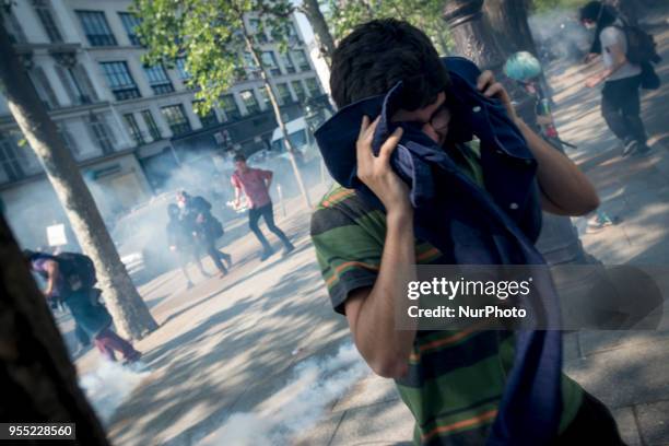 People take part in a protest dubbed a 'Party for Macron' against the policies of the French president on the first anniversary of his election, on...