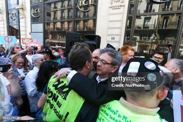 French member of Parliament and leader of the far left La France Insoumise party Jean-Luc Melenchon speaks with demonstrators during a protest dubbed...