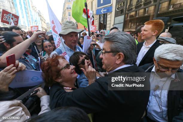 French member of Parliament and leader of the far left La France Insoumise party Jean-Luc Melenchon speaks with demonstrators during a protest dubbed...