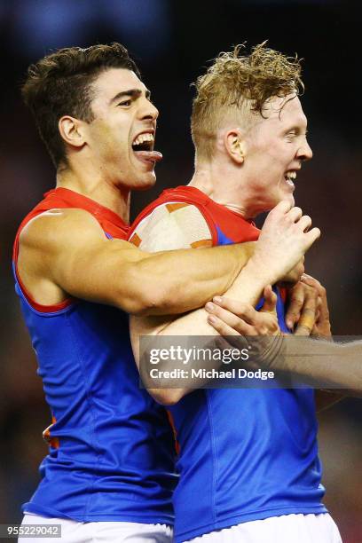 Clayton Oliver of the Demons celebrates a goal with Christian Petracca during the round seven AFL match between St Kilda Saints and the Melbourne...
