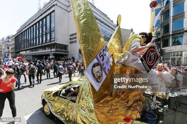 Parade float mocking the French President in front of France Press Agency headquarters during a protest dubbed a &quot;Party for Macron&quot; against...
