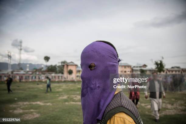 Kashmiri Muslim protester looks upon during the funeral procession of a civilian Adil Ahmed Saturday, May 5 in Srinagar, Indian-controlled Kashmir....