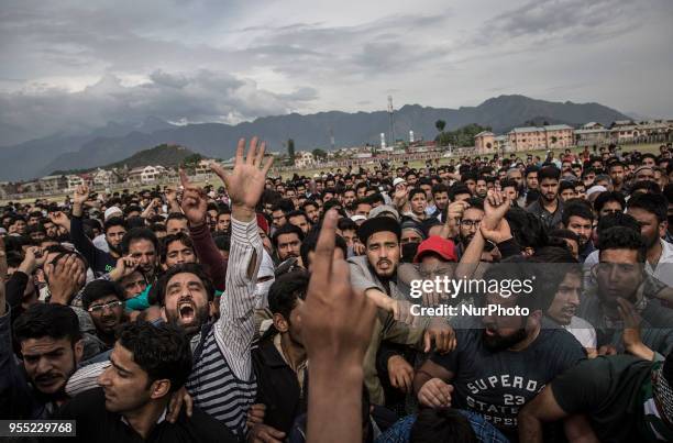 Kashmiri Muslims carry the body of Adil Ahmad, a civilian who was crushed to death by an Indian forces' vehicle, during his funeral procession...