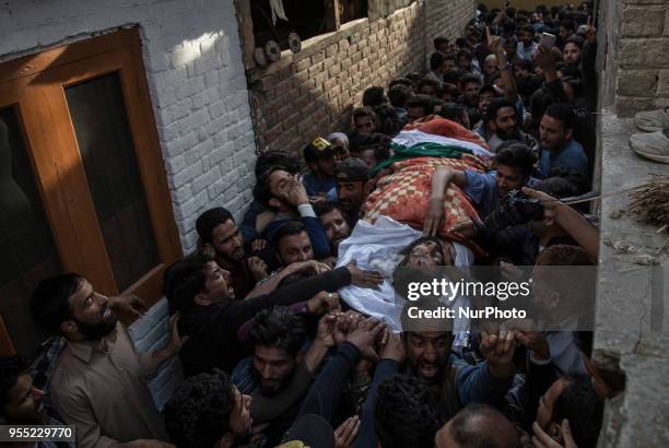 Kashmiri Muslims carry the body of Fayaz Ahmad Hamal, a local rebel, during his funeral procession Saturday, May 5 in Srinagar, Indian-controlled...